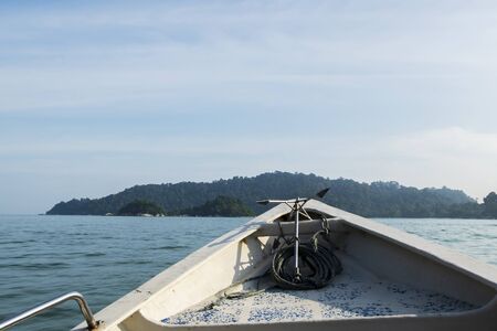 tourist enjoy the beauty of nature surrounding Pangkor Island located in Perak State, Malaysia during island hoping activityの写真素材