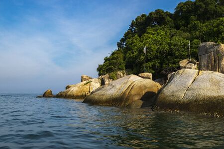 tourist enjoy the beauty of nature surrounding Pangkor Island located in Perak State, Malaysia during island hoping activityの写真素材