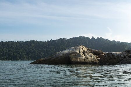 sightseeing crocodile look rock during Island hoping activity in Pangkor Island, Perak State, Malaysiaの写真素材