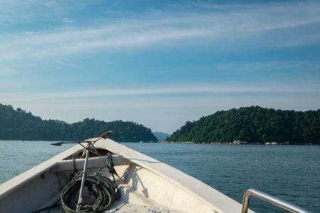 tourist enjoy the beauty of nature surrounding Pangkor Island located in Perak State, Malaysia during island hoping activityの写真素材