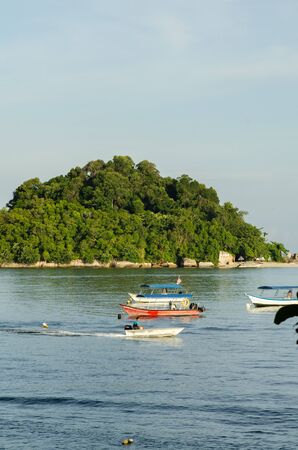 group of speed boat for island hoping activities moored on the Nipah Bay pangkor Island, Malaysiaの写真素材