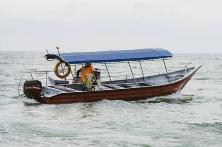 speed boat for island hoping activities moored on the Nipah Bay pangkor Island, Malaysiaの写真素材