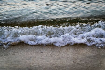 soft wave hiting sandy beach at Nipah Bay Pangkor Island, Malaysiaの写真素材