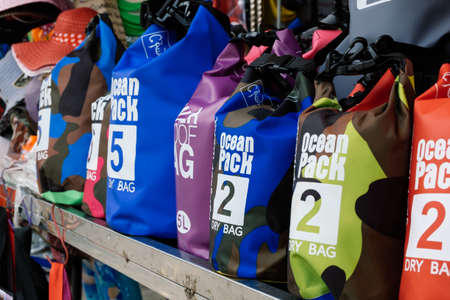 PANGKOR ISLAND, MALAYSIA - MARCH 15, 2020: variety of dry bag can be found at street stall around Nipah Bay for beach activities usageのeditorial素材