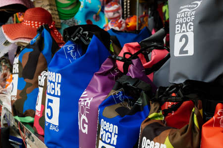 PANGKOR ISLAND, MALAYSIA - MARCH 15, 2020: variety of dry bag can be found at street stall around Nipah Bay for beach activities usageのeditorial素材