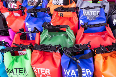 PANGKOR ISLAND, MALAYSIA - MARCH 15, 2020: variety of dry bag can be found at street stall around Nipah Bay for beach activities usageのeditorial素材