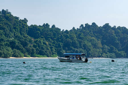 PANGKOR ISLAND, MALAYSIA - MARCH 15, 2020: Boat for island hopping and water sport activities at Nipah Bayのeditorial素材