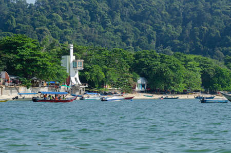PANGKOR ISLAND, MALAYSIA - MARCH 15, 2020: Boat for island hopping and water sport activities at Nipah Bayのeditorial素材