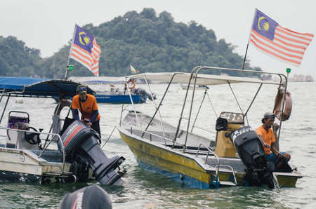 PANGKOR ISLAND, MALAYSIA - MARCH 15, 2020: Boat for island hopping and water sport activities at Nipah Bayのeditorial素材