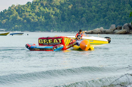 PANGKOR ISLAND, MALAYSIA - MARCH 15, 2020: Boat for island hopping and water sport activities at Nipah Bayのeditorial素材