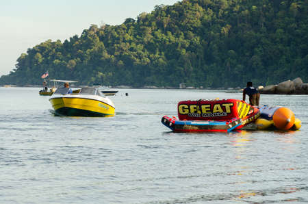 PANGKOR ISLAND, MALAYSIA - MARCH 15, 2020: Boat for island hopping and water sport activities at Nipah Bayのeditorial素材