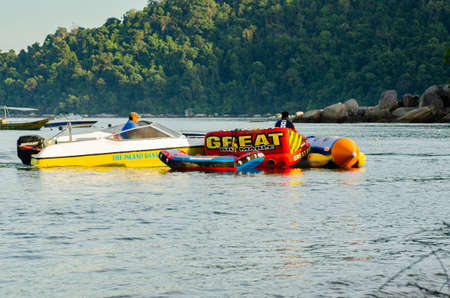 PANGKOR ISLAND, MALAYSIA - MARCH 15, 2020: Boat for island hopping and water sport activities at Nipah Bayのeditorial素材