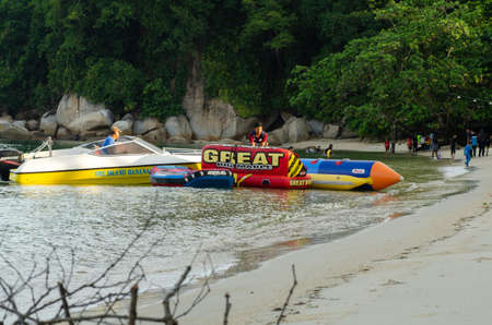 PANGKOR ISLAND, MALAYSIA - MARCH 15, 2020: Boat for island hopping and water sport activities at Nipah Bayのeditorial素材
