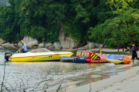 PANGKOR ISLAND, MALAYSIA - MARCH 15, 2020: Boat for island hopping and water sport activities at Nipah Bayのeditorial素材