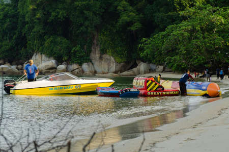 PANGKOR ISLAND, MALAYSIA - MARCH 15, 2020: Boat for island hopping and water sport activities at Nipah Bayのeditorial素材