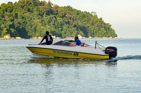 PANGKOR ISLAND, MALAYSIA - MARCH 15, 2020: Boat for island hopping and water sport activities at Nipah Bayのeditorial素材