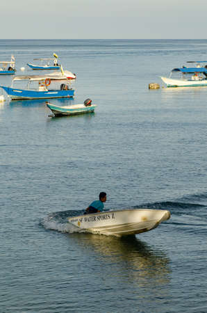 PANGKOR ISLAND, MALAYSIA - MARCH 15, 2020: Boat for island hopping and water sport activities at Nipah Bayのeditorial素材