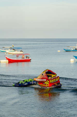 PANGKOR ISLAND, MALAYSIA - MARCH 15, 2020: Boat for island hopping and water sport activities at Nipah Bayのeditorial素材