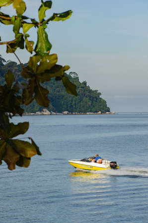 PANGKOR ISLAND, MALAYSIA - MARCH 15, 2020: Boat for island hopping and water sport activities at Nipah Bayのeditorial素材