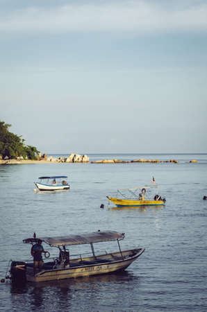 PANGKOR ISLAND, MALAYSIA - MARCH 15, 2020: Boat for island hopping and water sport activities at Nipah Bayのeditorial素材