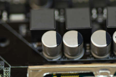 Closeup shot image of electronic circuit board. Shallow depth of field and selective focus. noise and grain due to low lightの写真素材