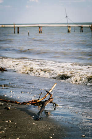 Nature compsition, wave hitting sandy beach under bright sunny day.selective focus shotの写真素材