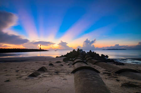 Long exposure seascape and rocky beach against sunset background. Nature composition with Soft and grain effectの写真素材