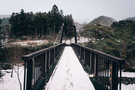 white snow and river landscape during winter season in Japanの写真素材