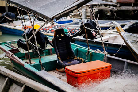 Beautiful view at Traditional fishing village with lovely sky and fishing boat moored near the shoreの写真素材