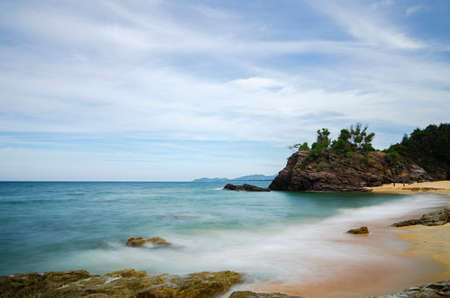 long exposure shot, peaceful scenery of tropical sandy beach under bright sunny day. nature compositon, noise and grain effectの写真素材