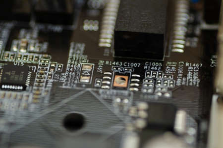 Closeup shot image of electronic circuit board. Shallow depth of field and selective focusの写真素材