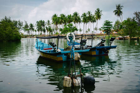beauty in nature, traditional fisherman boat at Terengganu, Malaysia beach under bright sunny day and blue skyの写真素材