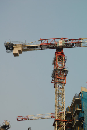 Singapore, Jun 18, 2013 - Cranes at construction site of a private condominium in Singapore taken in the day on June 18, 2013のeditorial素材