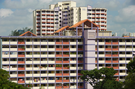 Singapore, Singapore - Feb 05, 2015 - New and old Singapore public housing (HDB) in the same estate taken in the day on Feb 05, 2015のeditorial素材