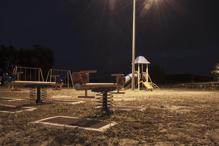 Empty playground at night