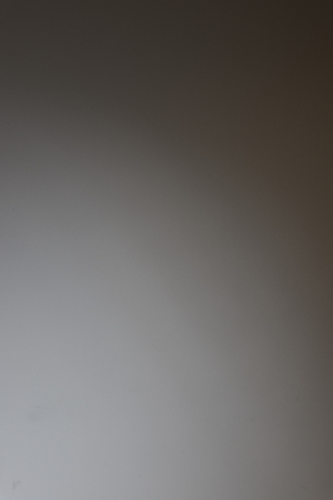 Single light source from bottom left on black backgroundの写真素材