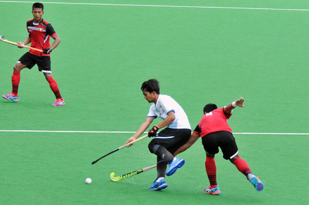 Singapore, Singapore - June 27, 2018 - Action during an international Hockey Open Series field match between Thailand and Myanmar held in Singaporeのeditorial素材