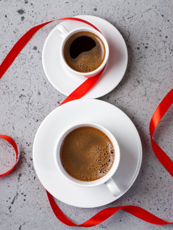 Two cups of coffee in the form of 8 international women's day conceptの写真素材