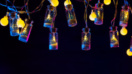 Christmas background, small Christmas tree in a glass jar garland, neon lighting, copyspaceの写真素材
