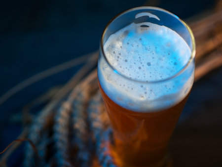 Close-up of a glass of wheat beer top view, wheat ears