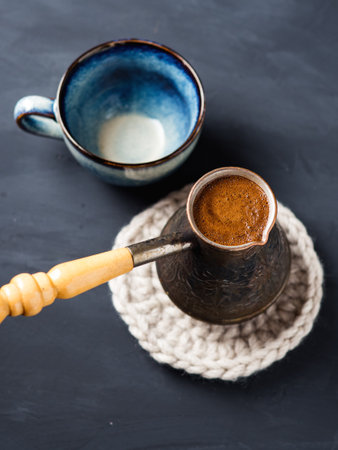 Turkish freshly brewed coffee in jezveの写真素材