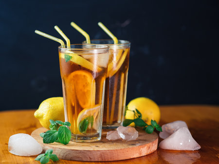 Two glasses of summer ice tea with lemon and mint. Refreshing citrus drinkの写真素材