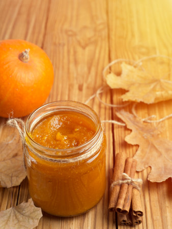 Homemade Pumpkin puree/jam on wooden backgroundの写真素材