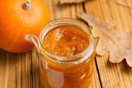 Homemade Pumpkin puree/jam on wooden backgroundの写真素材