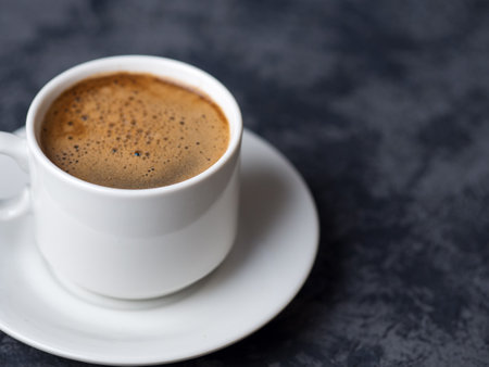 White espresso Cup on dark background with copyspaceの写真素材