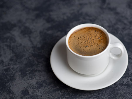White espresso Cup on dark background with copyspaceの写真素材