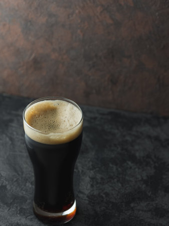 The dark glass of the craft beer porterの写真素材