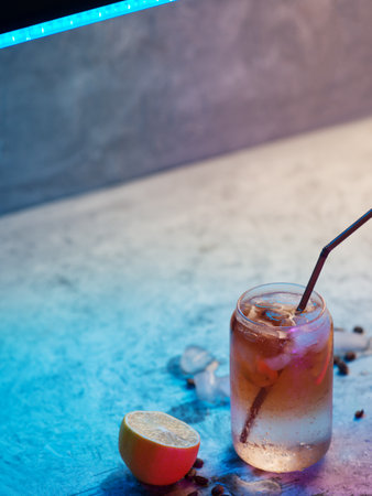 Refreshing summer trend drink espresso tonic, colored neon lightingの写真素材