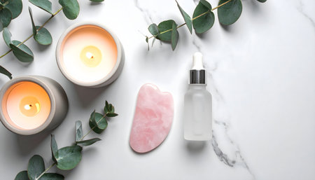 Spa and skincare essentials frosted glass oil bottle, pink jade roller, and small scented candle for a modern, luxurious routine.の素材