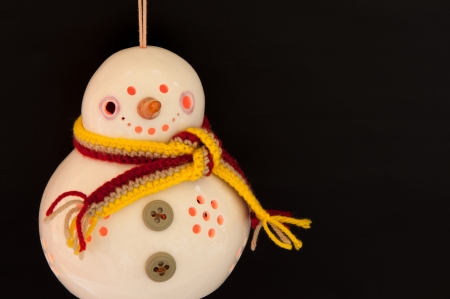 Christmas snowman ornament lights on black の写真素材